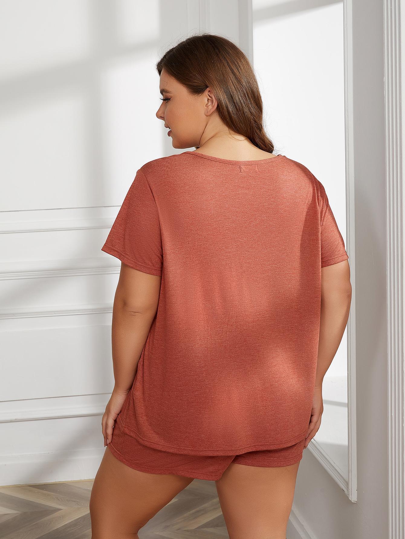 Back view of woman wearing round neck short sleeve plus size pajamas in rust color