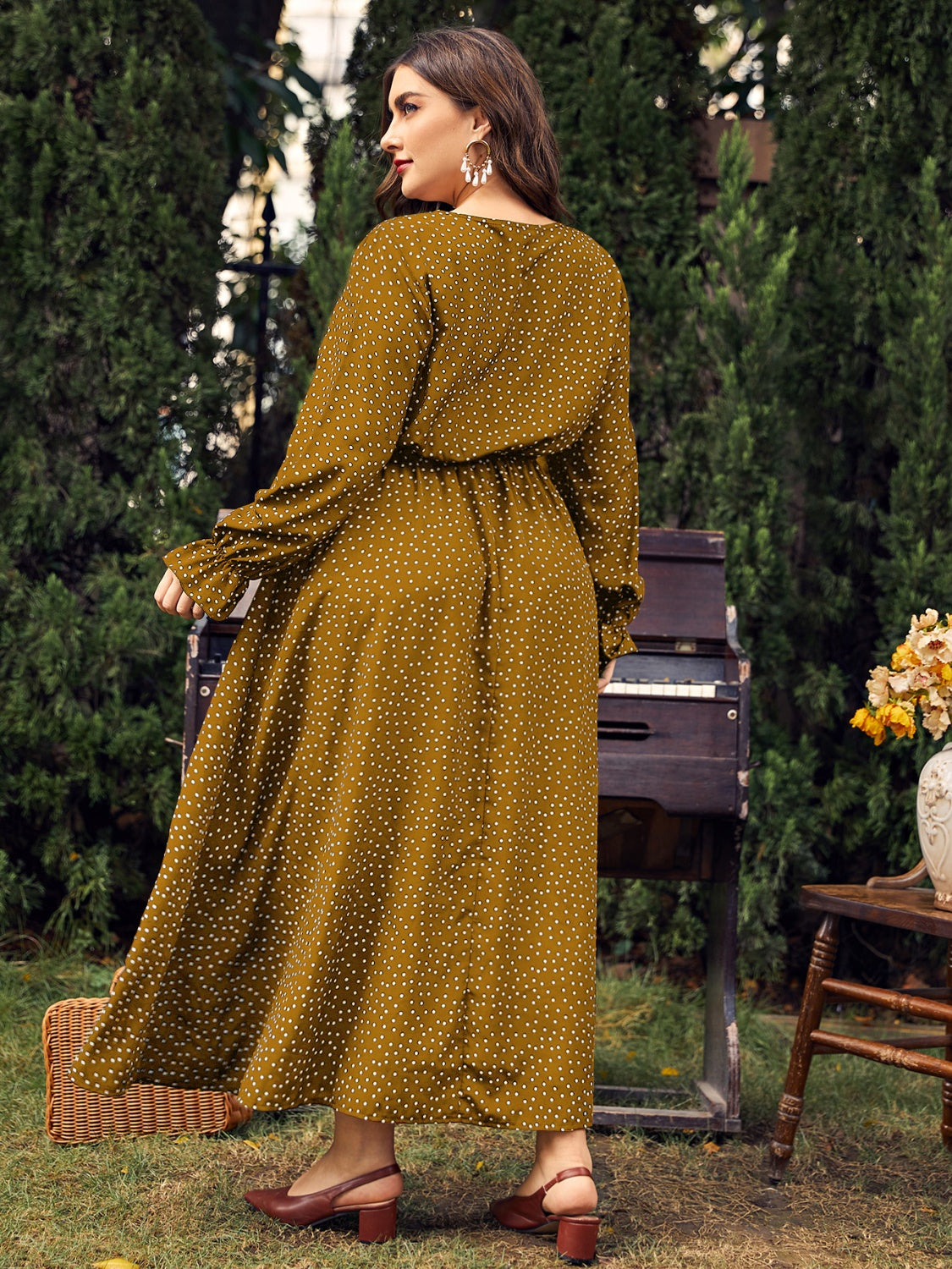 Honey plus size ruffled long sleeve dress in mustard yellow with white polka dots, featuring a defined waist and flowy hemline.
