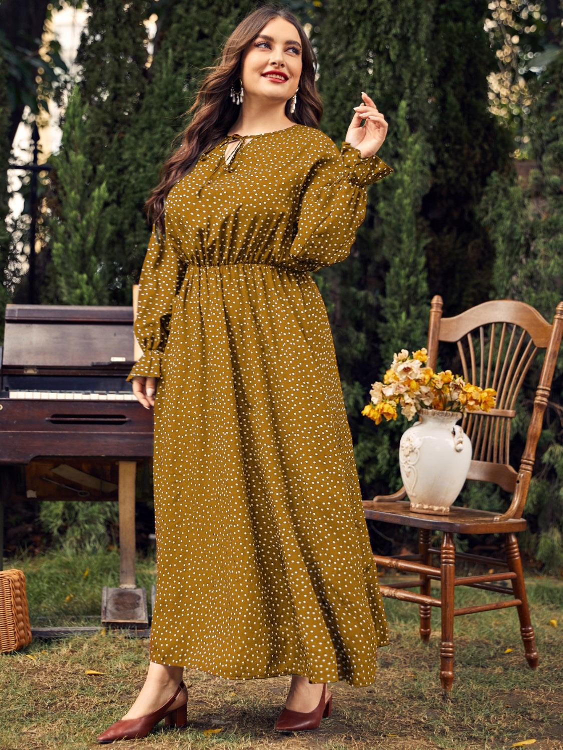 Honey plus size ruffled long sleeve dress in mustard with polka dots, featuring a defined waist and flowing hemline