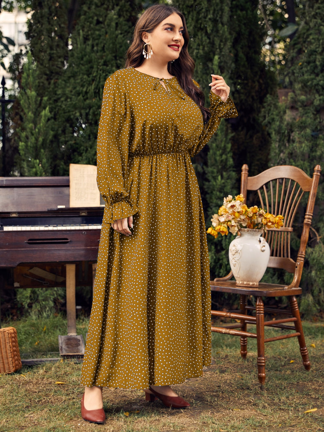Honey Plus Size ruffled long sleeve maxi dress with polka dot pattern and cinched waist in mustard color