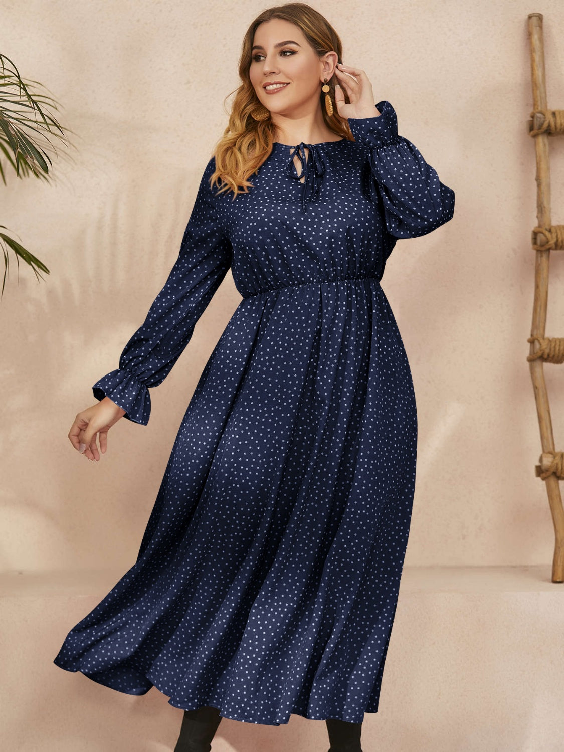Honey Plus Size navy polka dot ruffled long sleeve dress with waist definition and flowing skirt