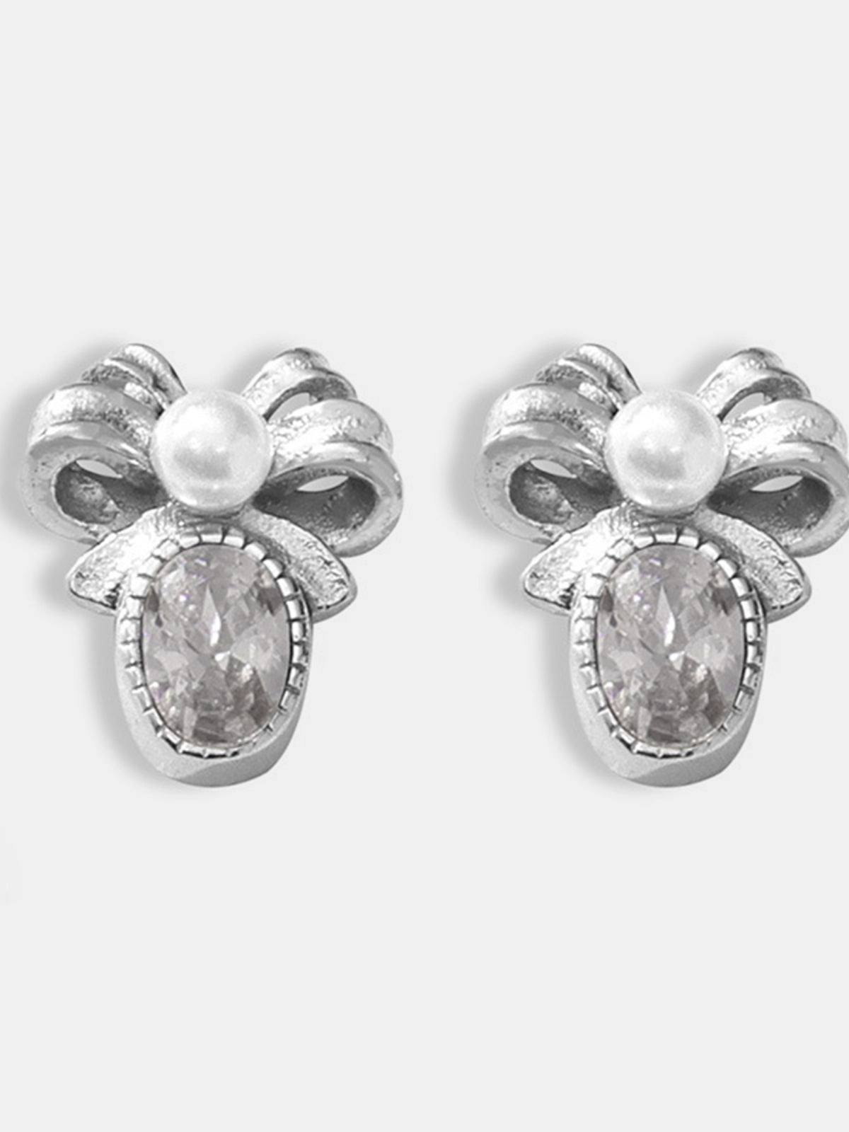 Trendsi titanium steel bow stud earrings with pearl and crystal embellishments