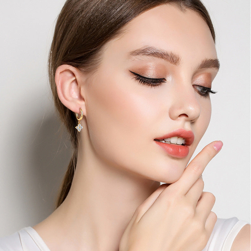 Trendsi sterling silver drop earrings for women worn by model with natural makeup and white top