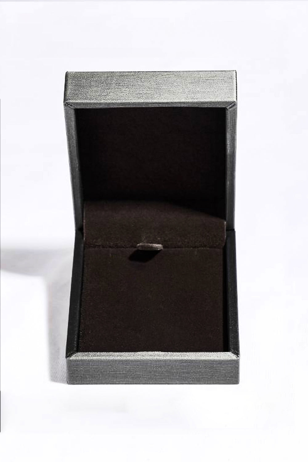 Empty gray jewelry box with black velvet interior for sterling silver ruby pendant necklace