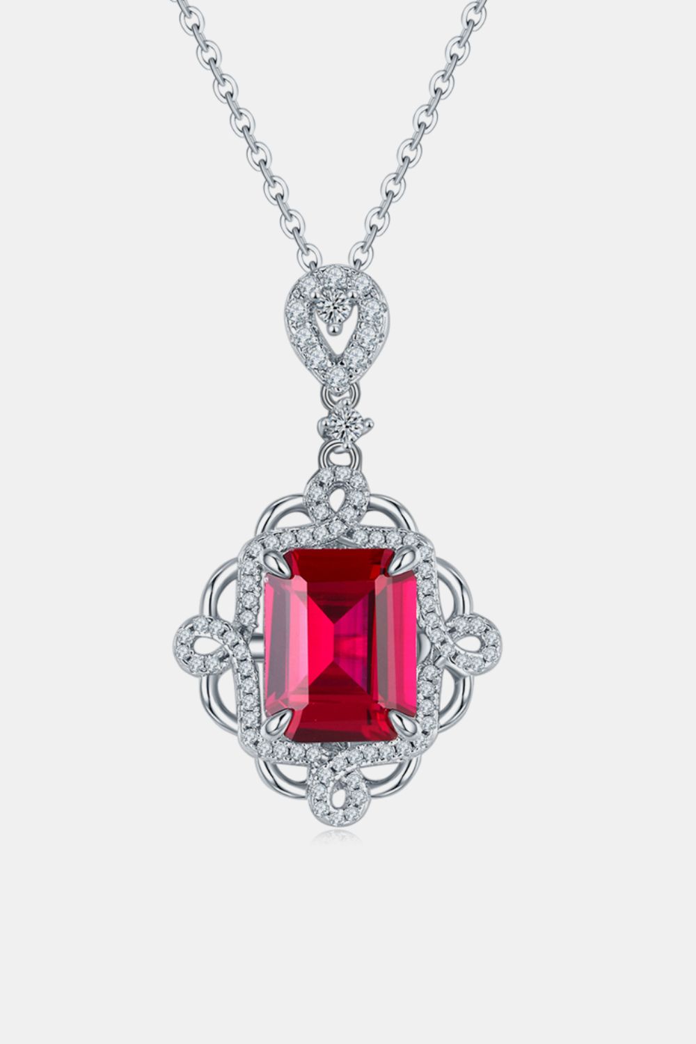 Elegant sterling silver ruby pendant necklace with a square ruby center stone and intricate detailing