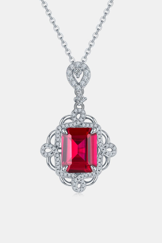 Elegant sterling silver ruby pendant necklace with a square ruby center stone and intricate detailing