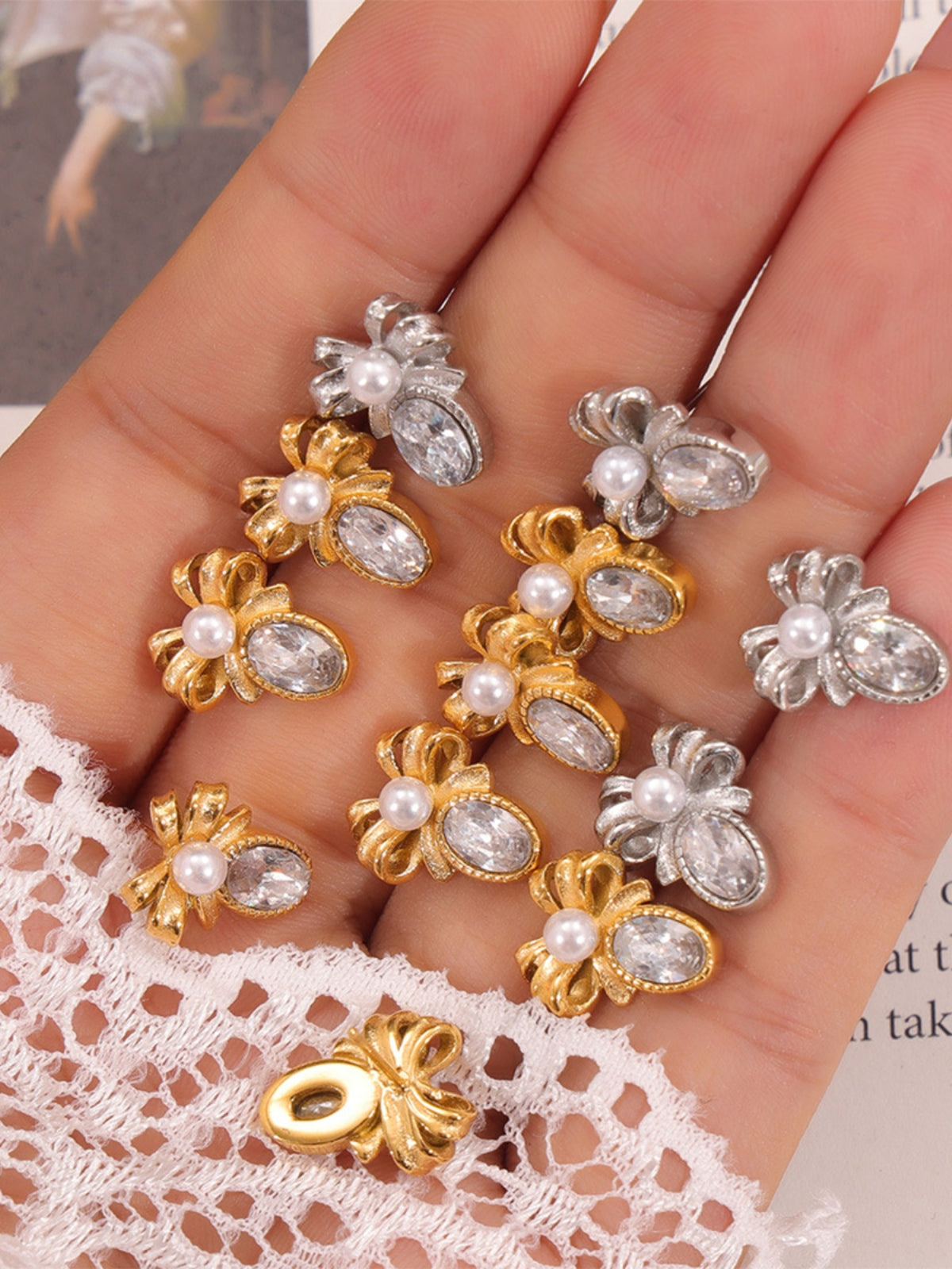 Trendsi titanium steel bow stud earrings in gold and silver with pearl and crystal accents