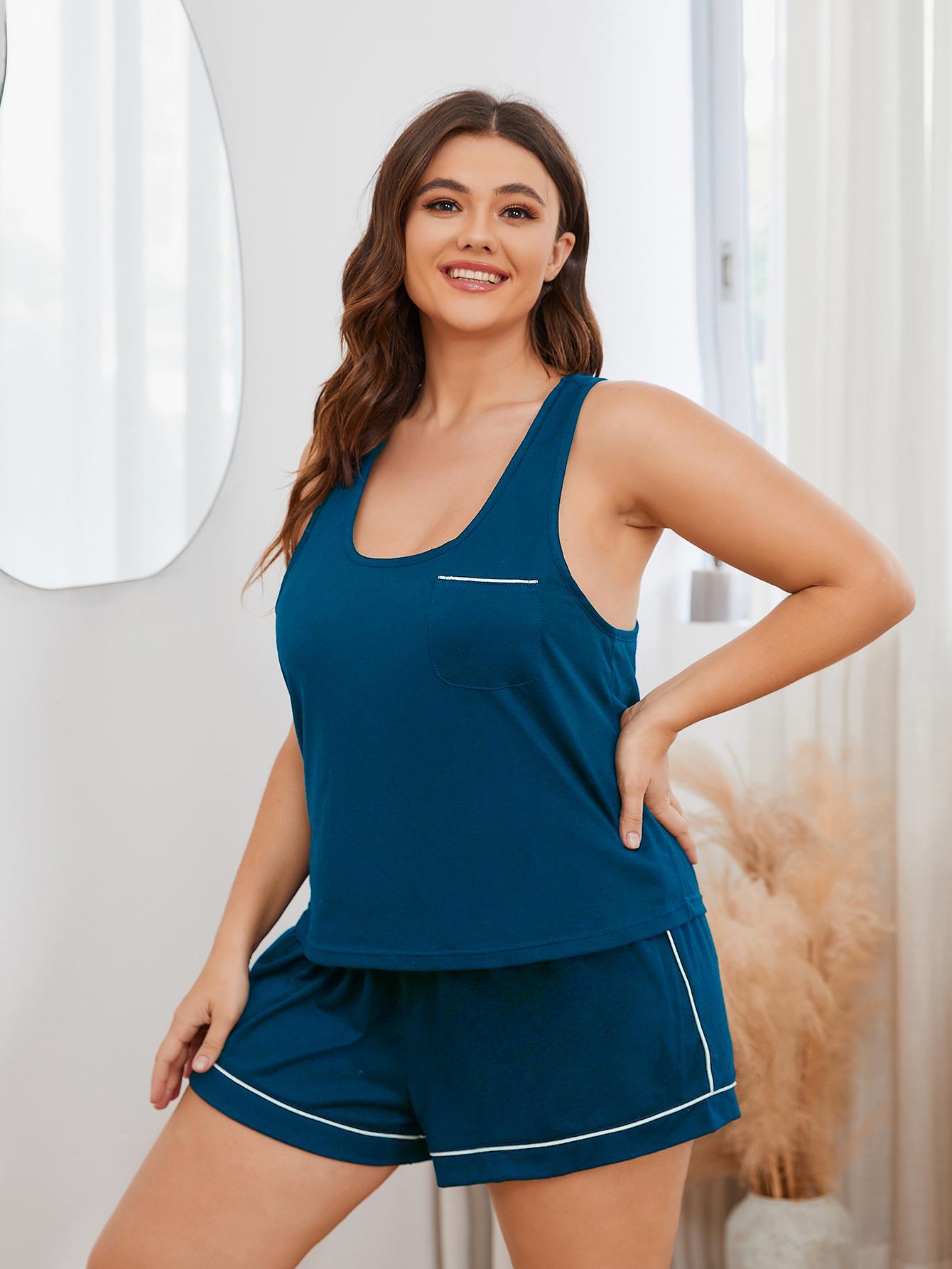 Trendy plus size sleepwear for women in dark blue sleeveless top and shorts set by Trendsi