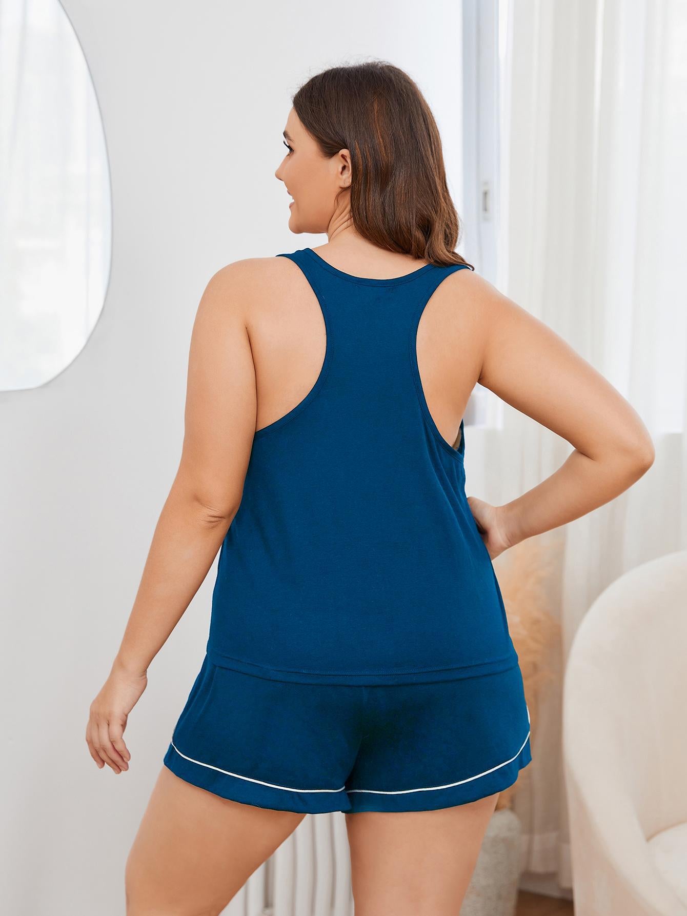 Trendy plus size sleepwear for women featuring navy blue tank top and matching shorts set