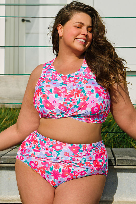Plus size model wearing a floral twisted high waist bikini for curvy women outdoors in sunlight