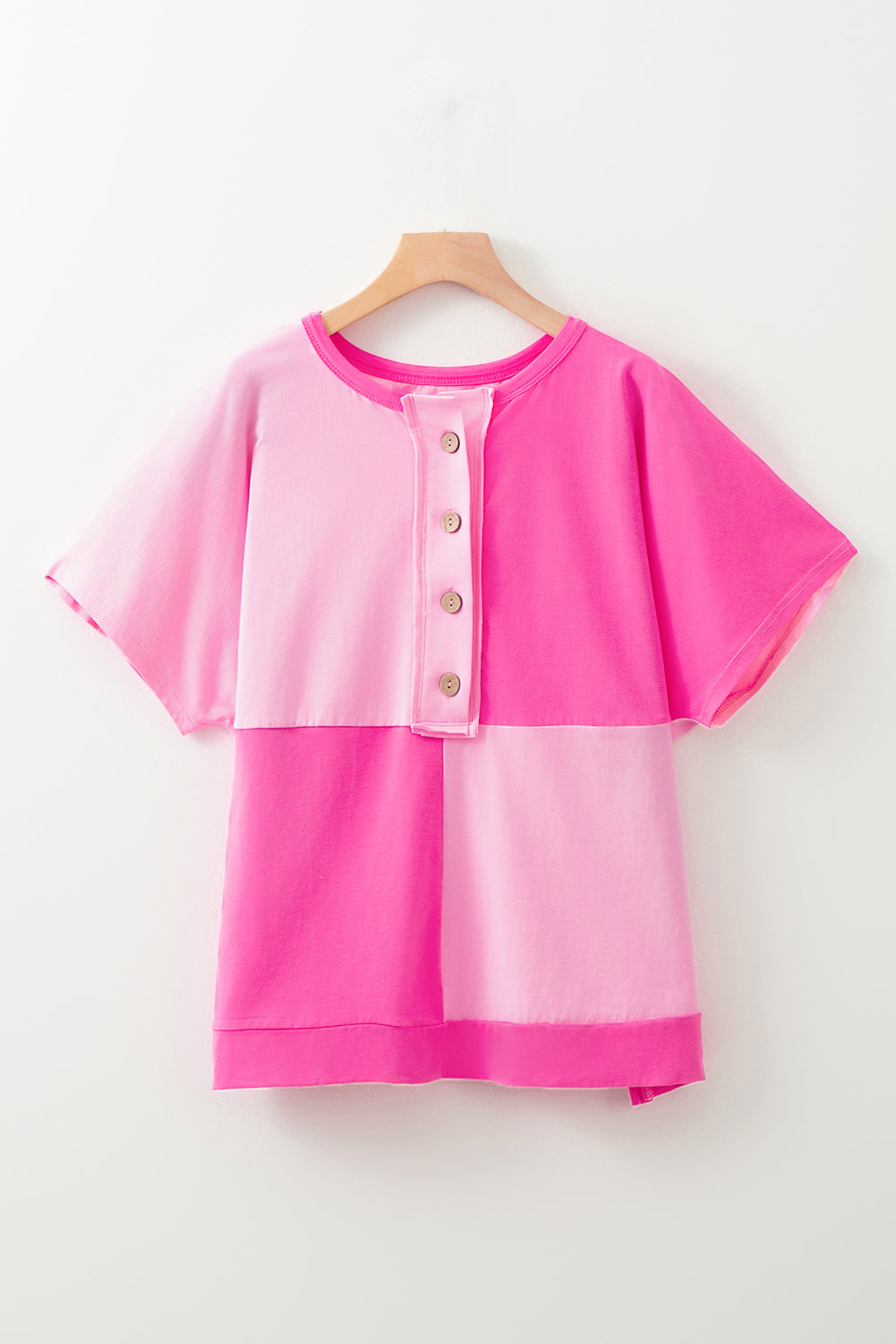 Bright pink short sleeve top for curvy women with color block design and button details