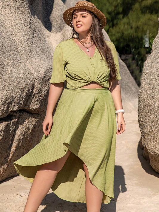 Trendsi curvy half sleeve matching set in light green featuring a knotted top and asymmetrical skirt