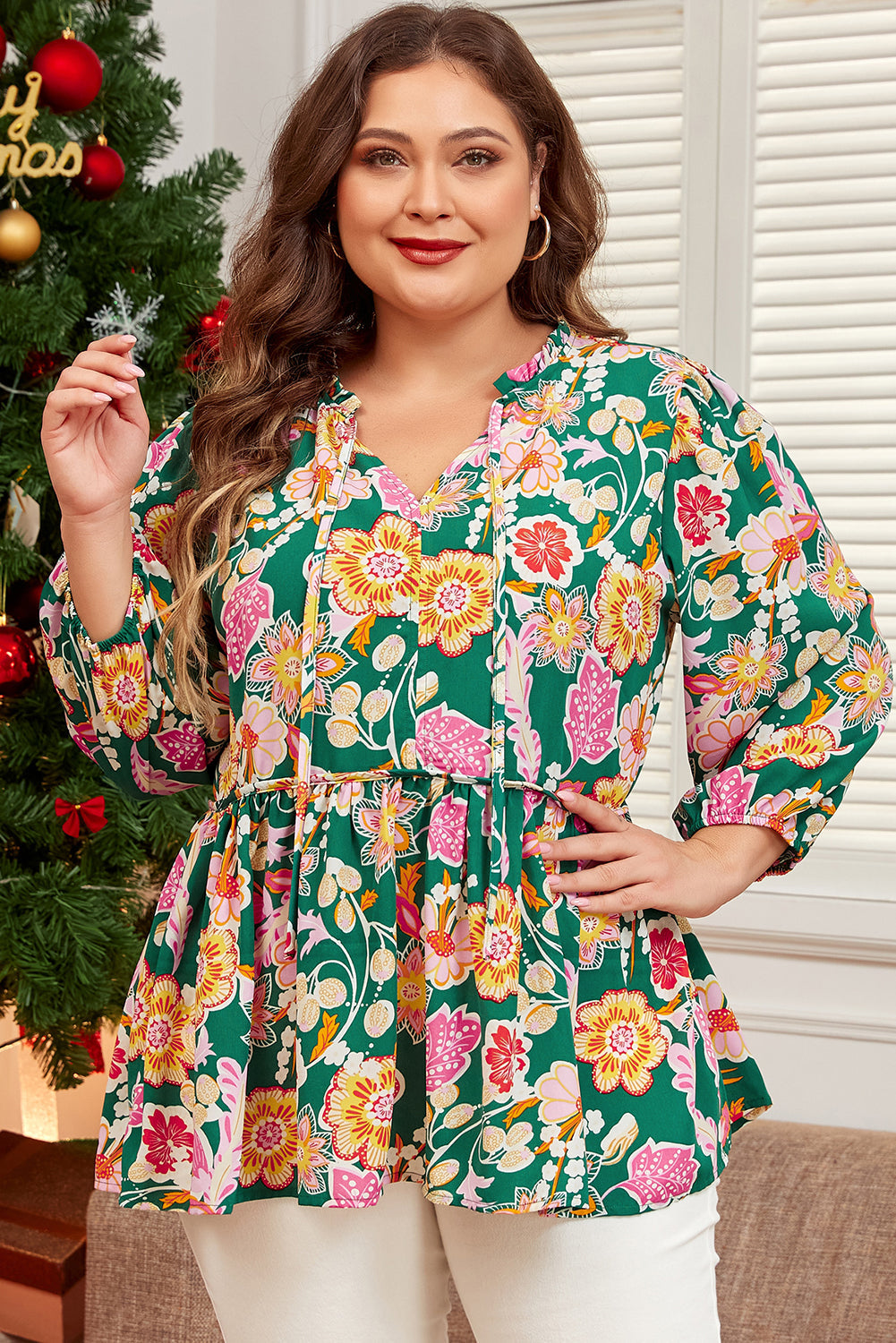 plus size green floral tied babydoll top with long sleeves and flowy silhouette