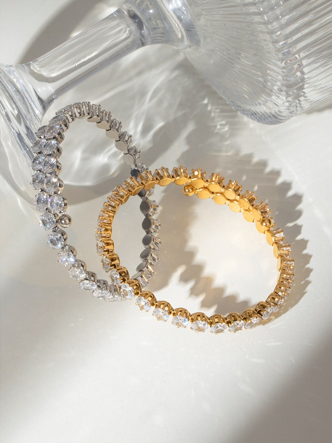 Trendsi stainless steel zircon bracelet in silver and gold with clear sparkling stones on white background