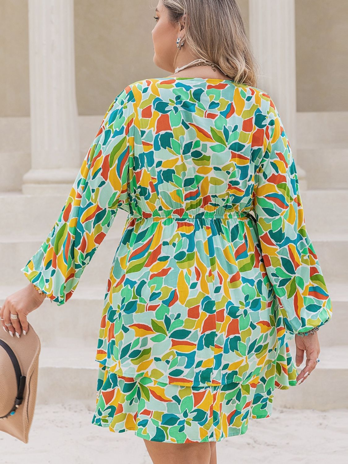 Trendsi surplice long sleeve dress for curvy women with colorful floral pattern and flowing skirt