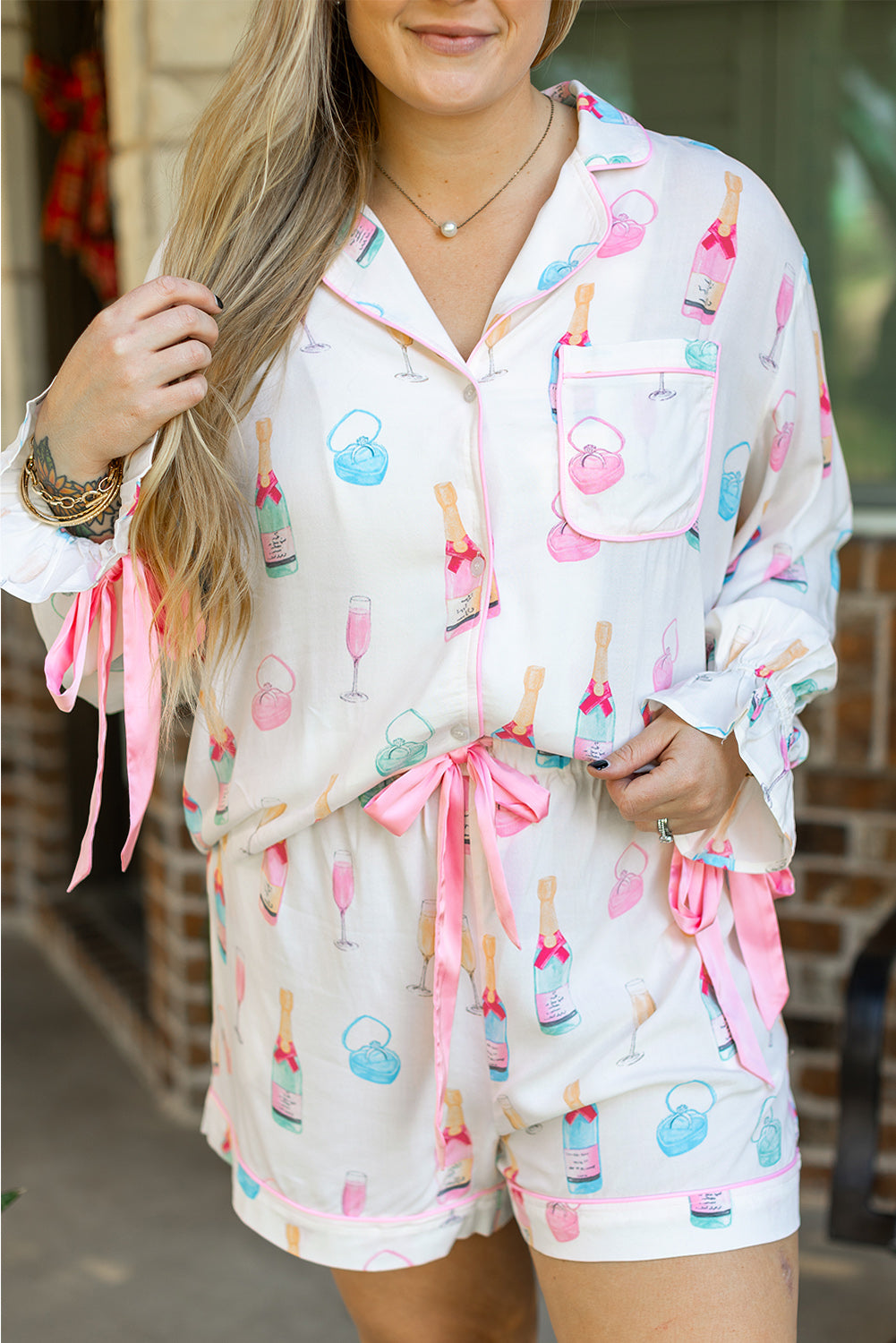 White bow knot sleepwear for curvy women featuring champagne bottle print and pink accents