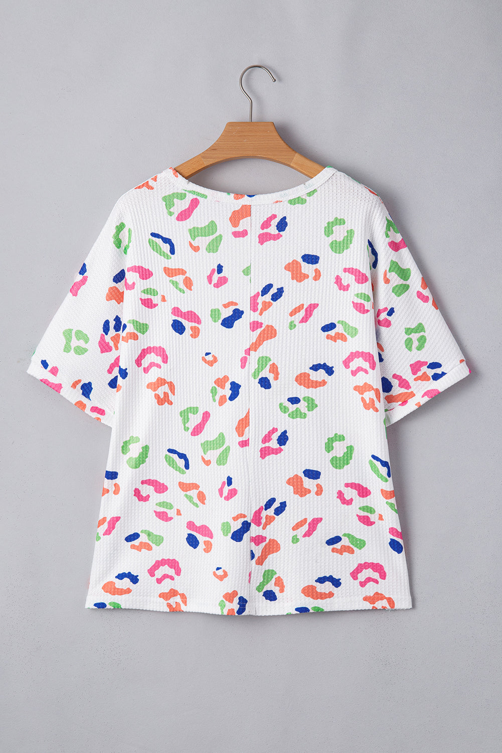 Plus size white multicolor leopard top for women with short sleeves and relaxed fit