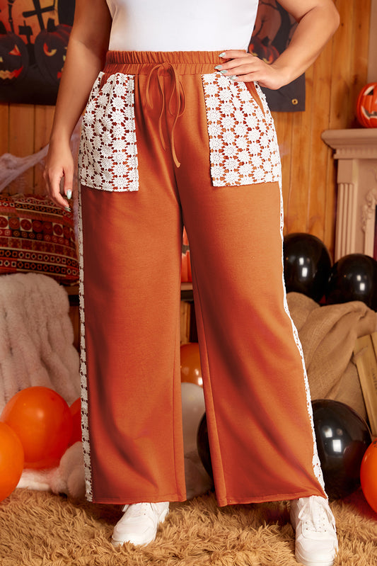 Plus size wide leg pants with drawstring and pockets in rust color with white crochet details