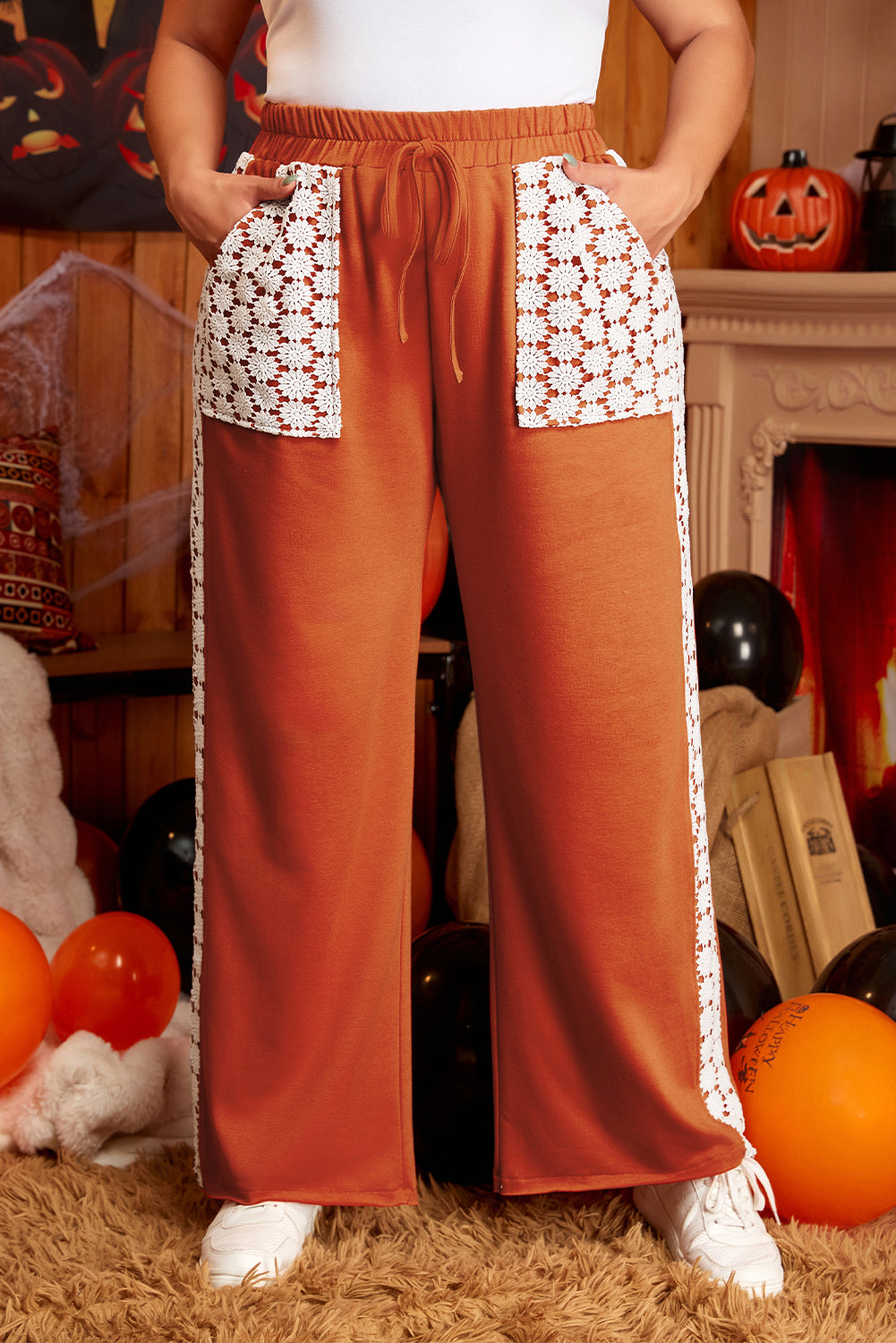 Plus size wide leg pants with drawstring and pockets in rust color with white lace detailing