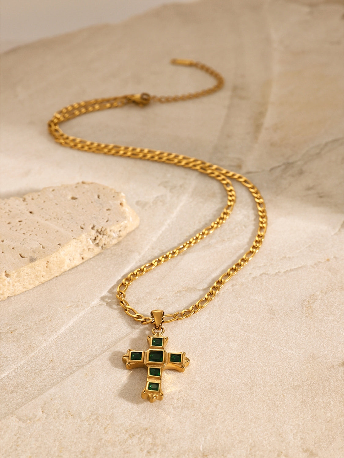 Gold chain necklace with a zircon cross pendant for women featuring green stones and elegant design