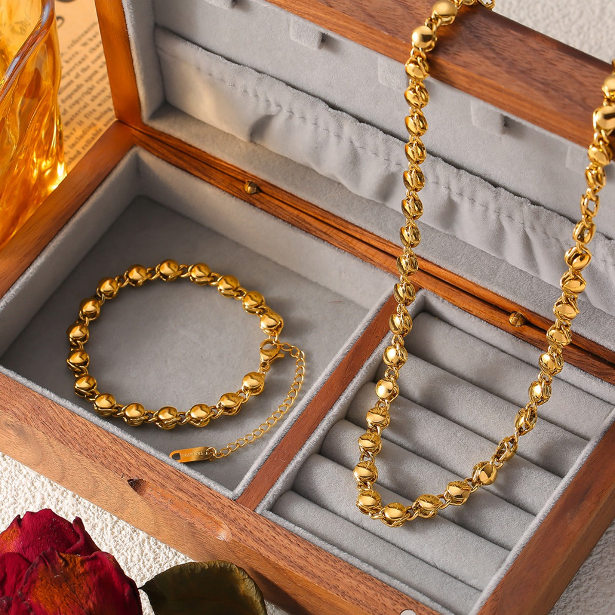 18K gold plated necklace and matching bracelet set displayed in a wooden jewelry box with gray velvet lining