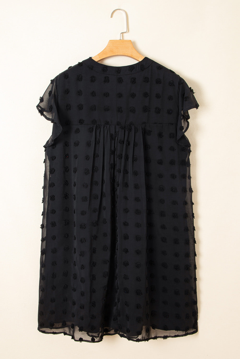 Black dotty plus size summer dress with sheer short sleeves and flowy silhouette by kjplussizefashion