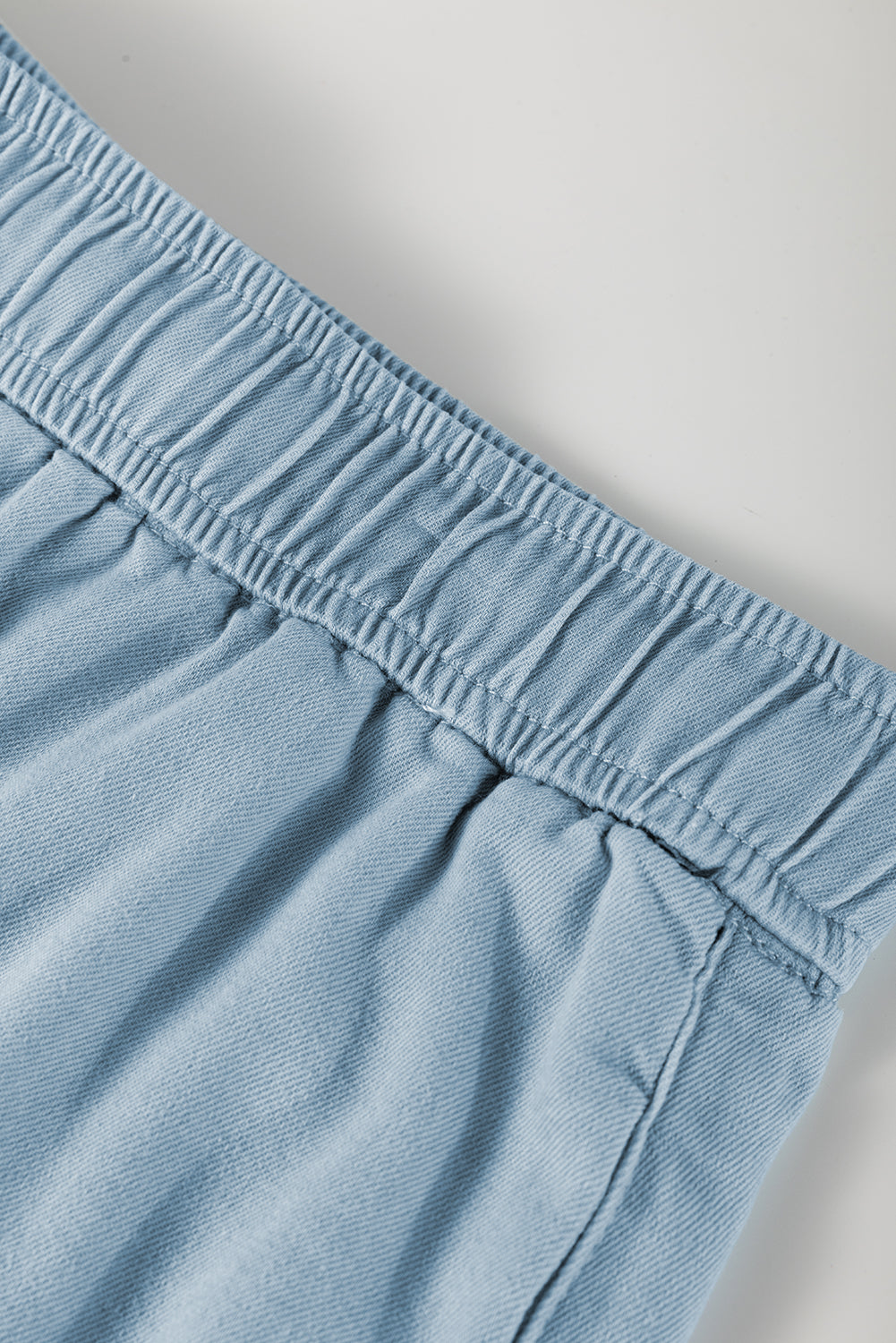 Close-up of blue elastic waist plus size summer shorts by kjplussizefashion showing fabric texture and stitching
