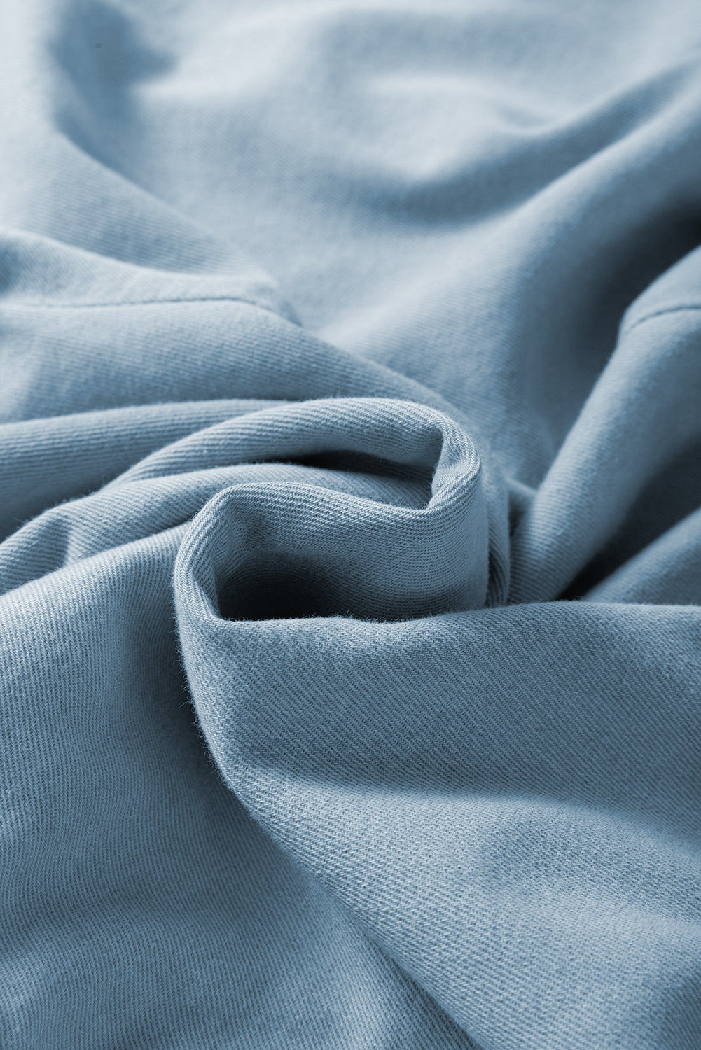 Close-up of soft blue fabric material for elastic waist plus size summer shorts by kjplussizefashion