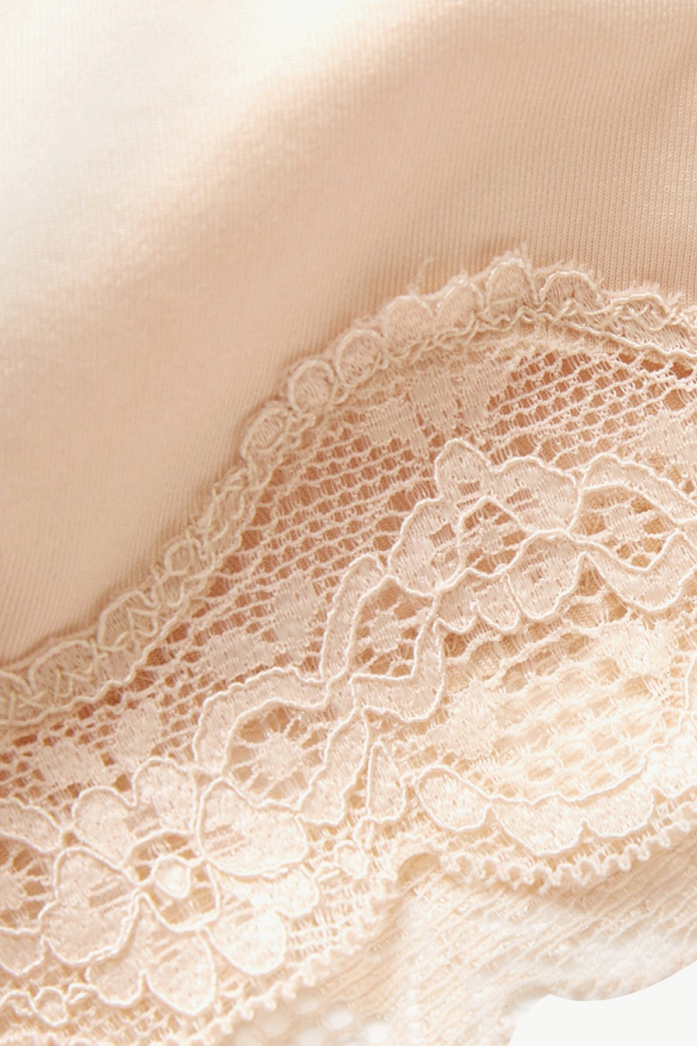 Close-up of beige comfortable lace shapewear for women showing intricate floral lace details