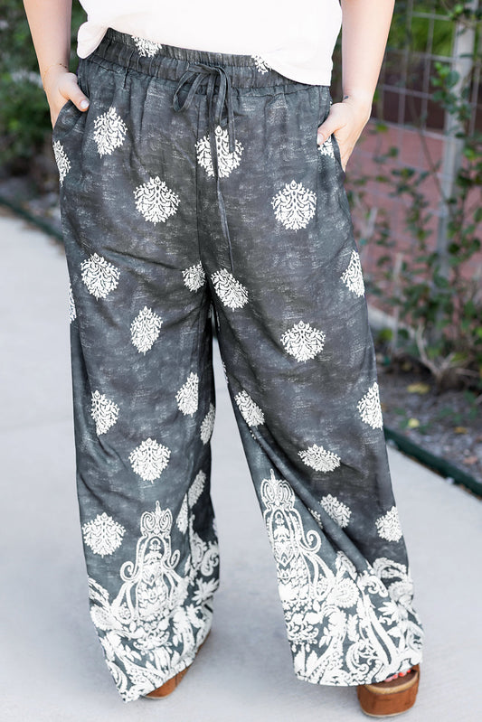 Comfortable plus size lounge pants in black with white floral patterns by kjplussizefashion