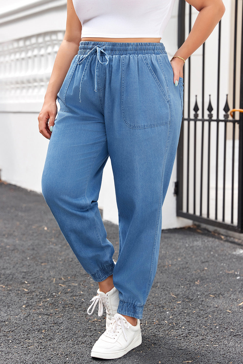 Plus size bottoms featuring blue drawstring waist plus size jeans with elastic cuffs and front pockets