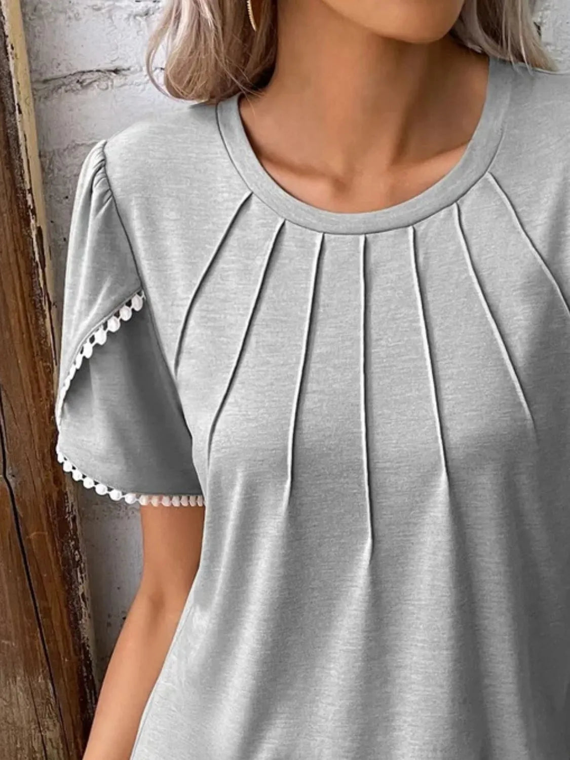 Gray full size round neck top for women with pleated front and short sleeves with trim detailing