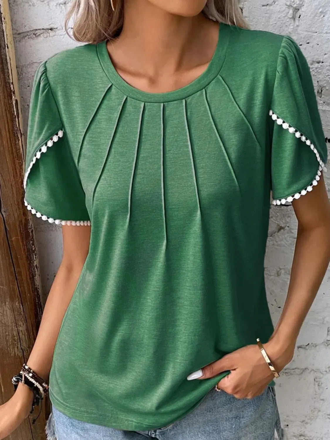 Green full size round neck top for women with pleated front and pompom trim sleeves
