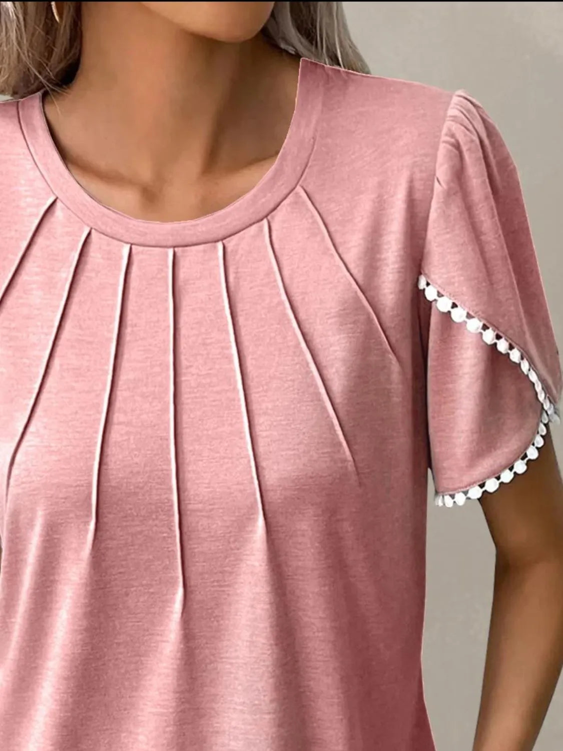 Pink full size round neck top for women with pleated front and white trim on short sleeves