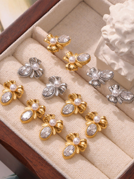 Trendsi titanium steel bow stud earrings in gold and silver with pearl and crystal detailing
