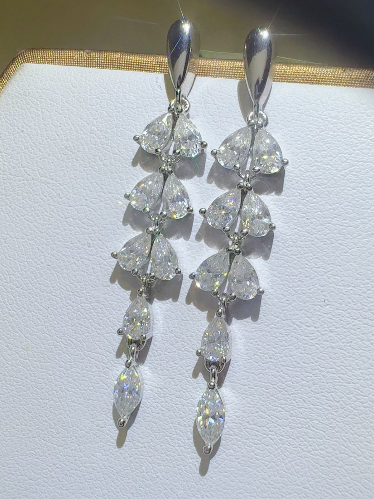 Trendsi moissanite bar earrings with multiple sparkling pear-shaped stones in a dangling design