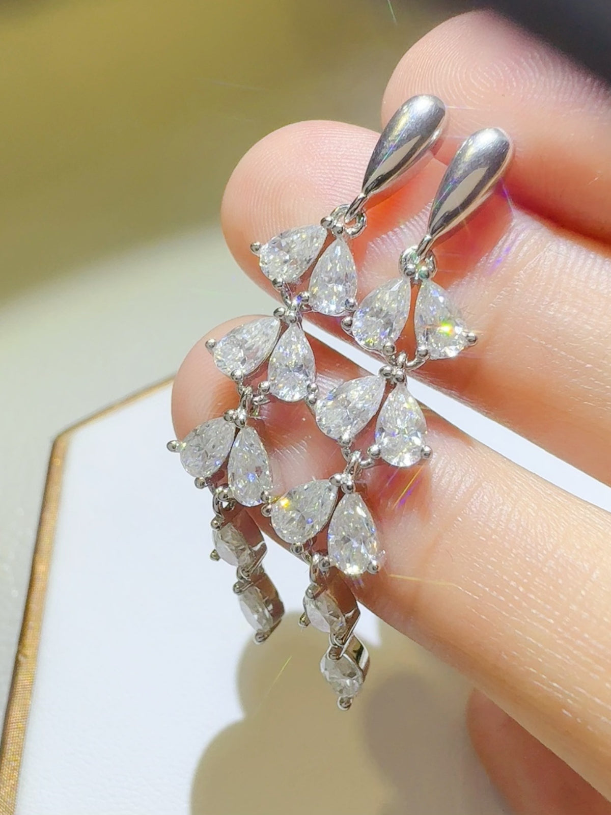 Trendsi moissanite bar earrings with multiple pear-shaped sparkling stones in silver setting