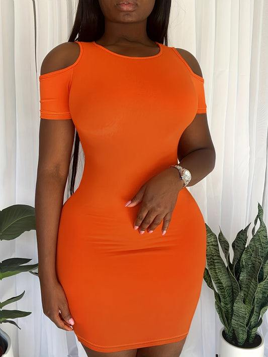 Plus size orange cold shoulder short sleeve mini dress on model with long hair and watch