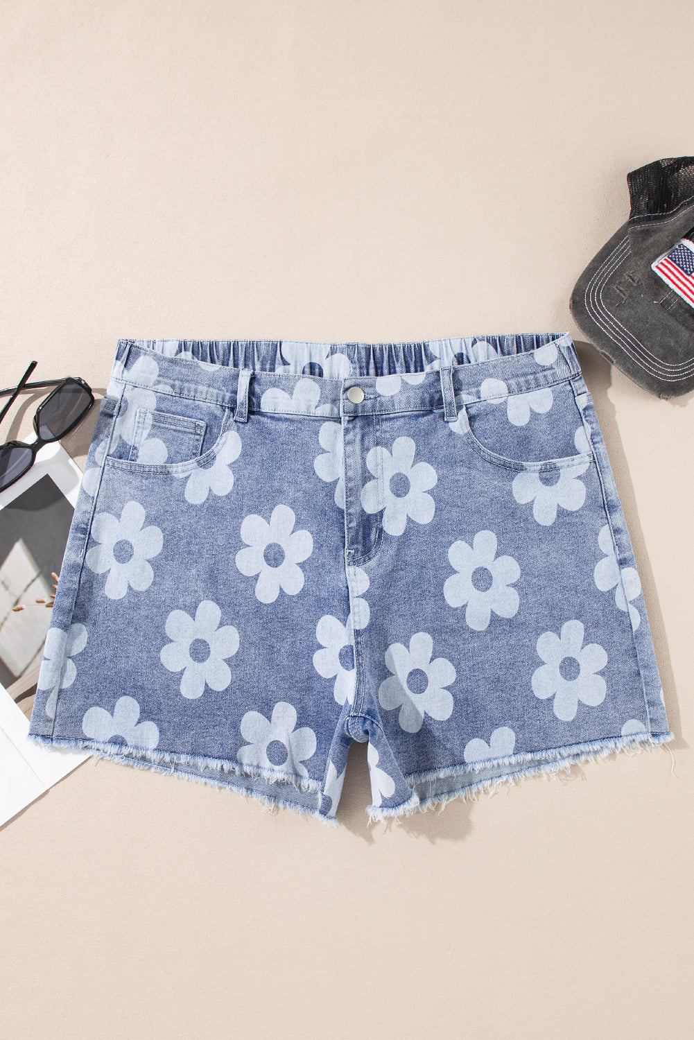 Plus size floral denim shorts with white flower print and frayed hem by kjplussizefashion