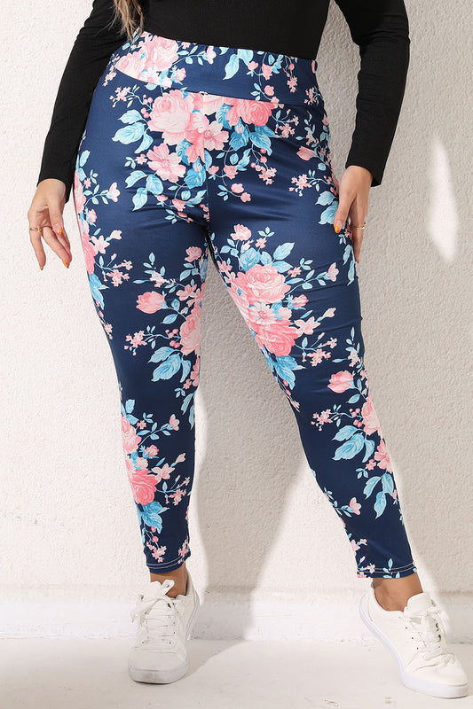Plus size floral leggings with pink and blue flowers on navy background from Trendsi