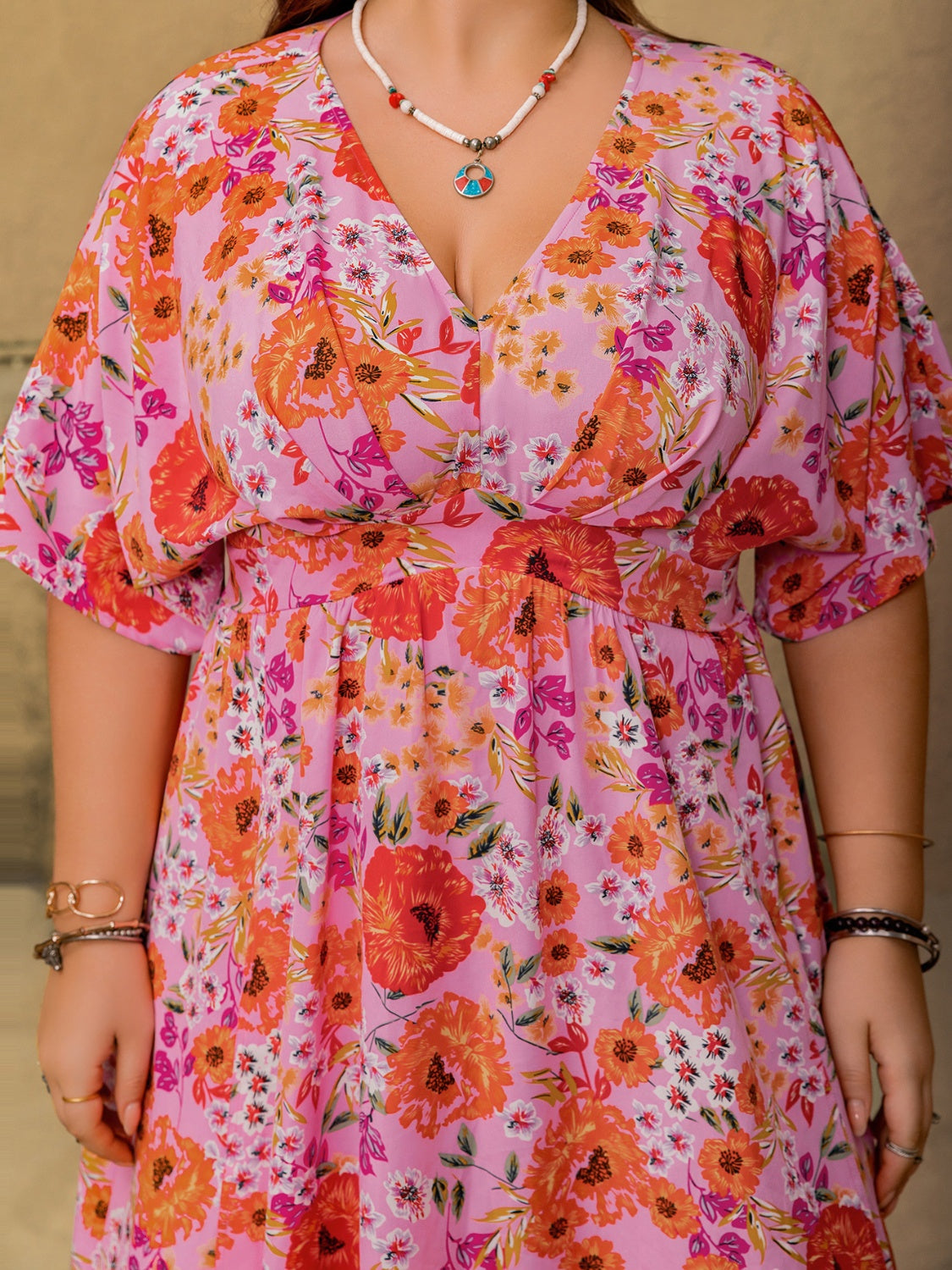 Trendsi plus size floral maxi dress with pink and orange flower print and V-neck design