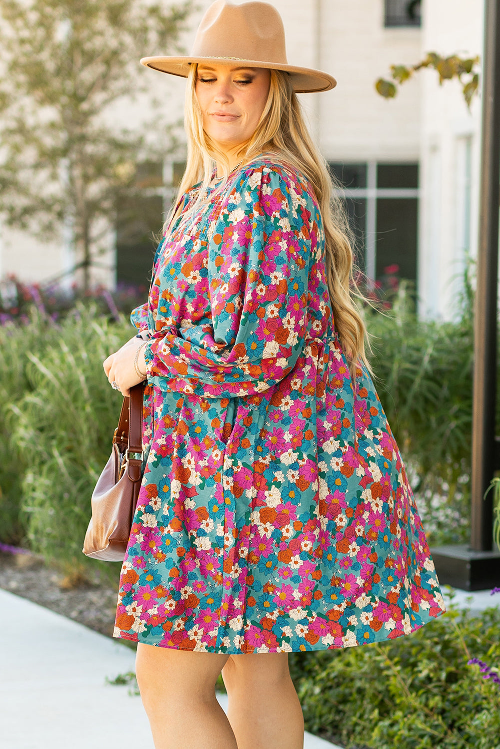 Plus size sky blue floral print shirred ruffle tiered mini dress with long sleeves and a relaxed fit