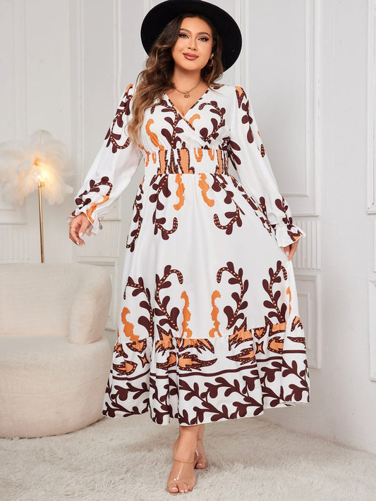 Plus size honey print dress for women with long sleeves and a flowy skirt worn with a black hat