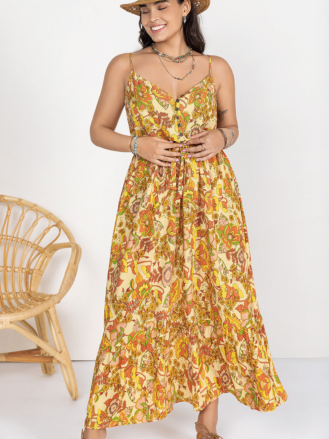 Trendsi plus size printed maxi dress with floral pattern and adjustable straps worn by smiling woman