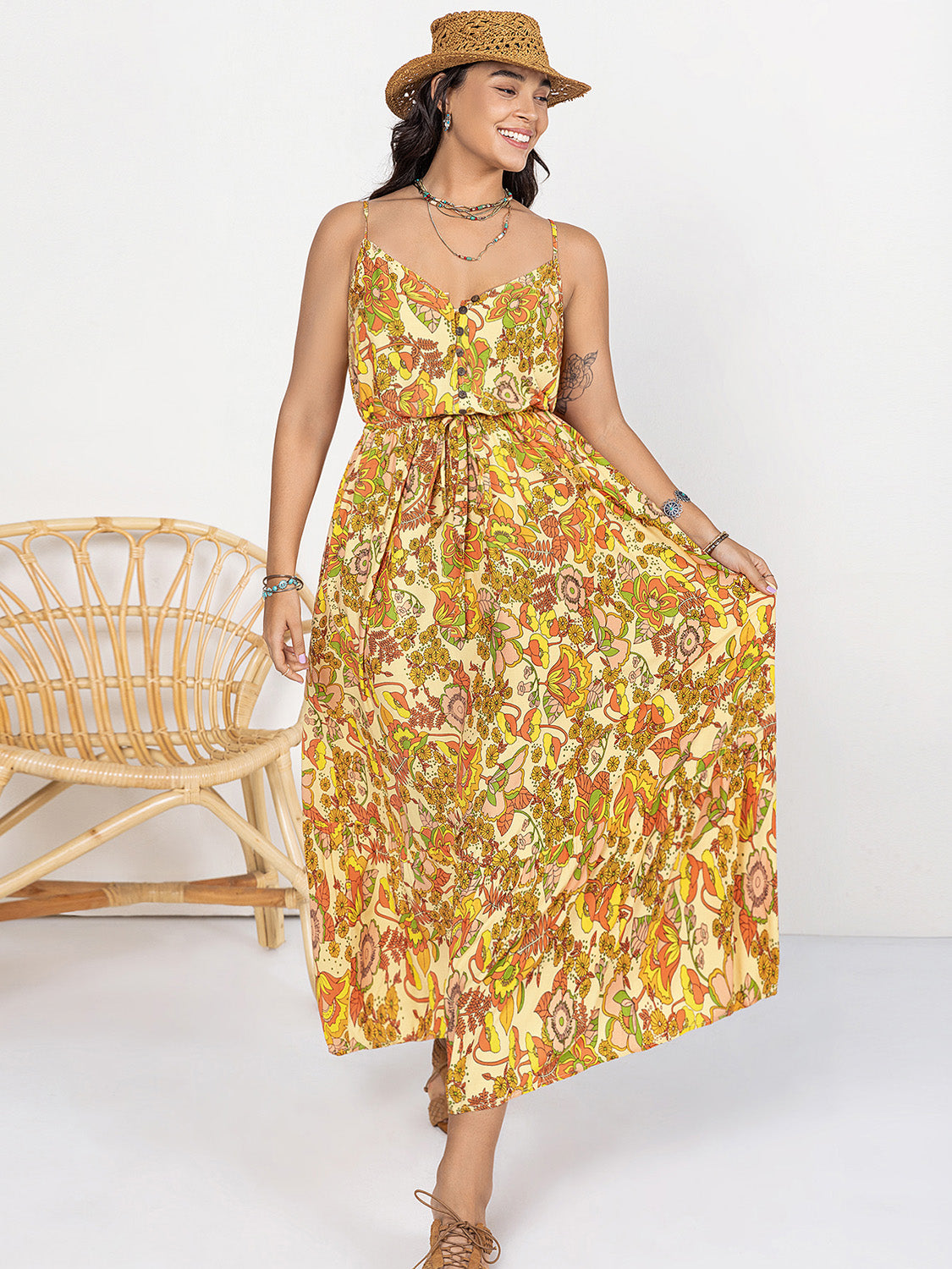 Trendsi plus size printed maxi dress with floral patterns, adjustable waist tie, and spaghetti straps