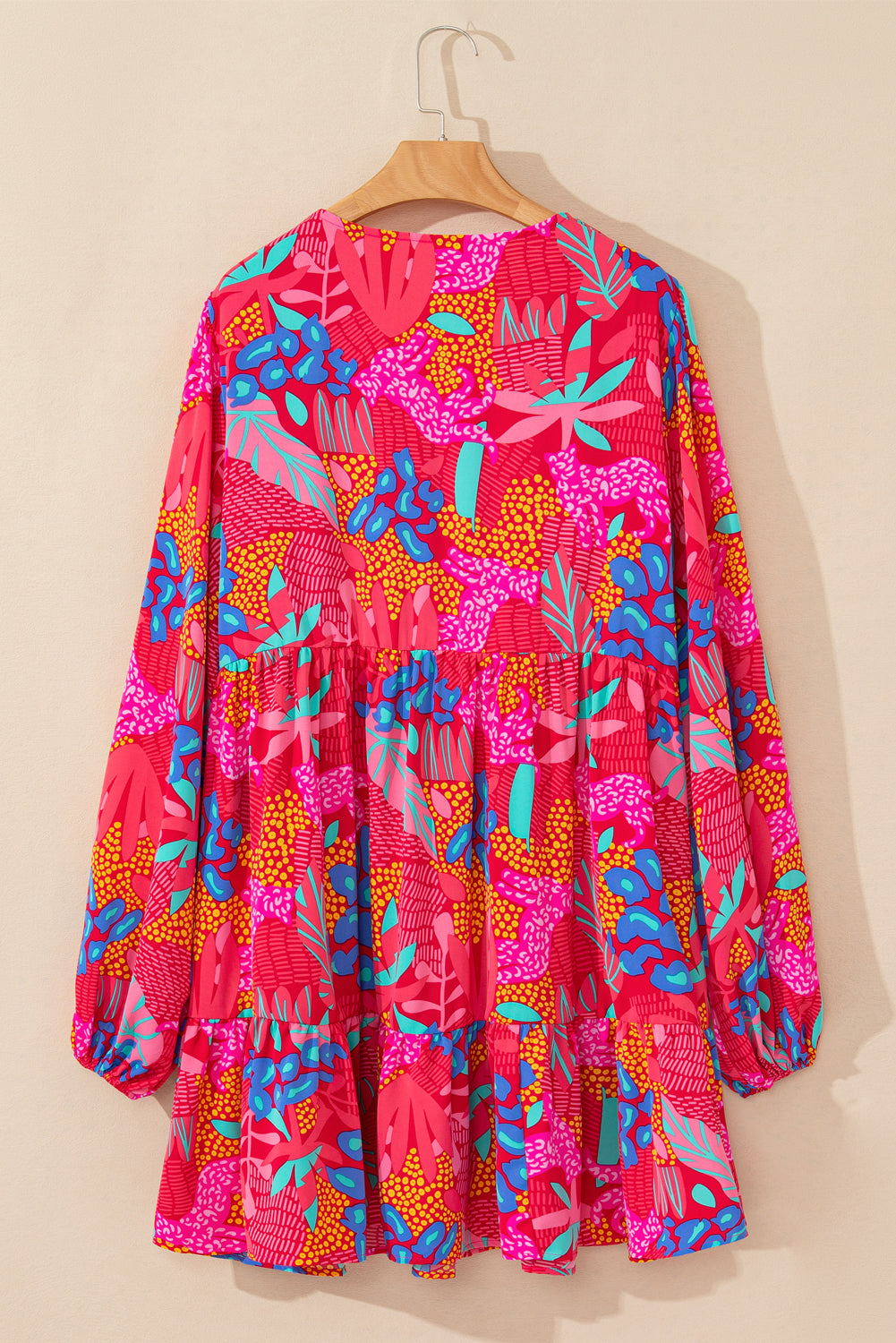 Plus size tropical print mini dress with long sleeves and vibrant red blue and pink colors