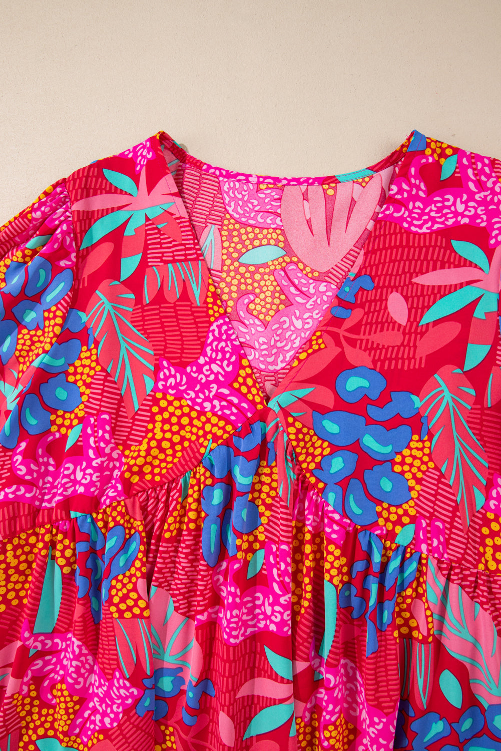 Plus size tropical print mini dress with vibrant pink, blue, and green floral design by kjplussizefashion