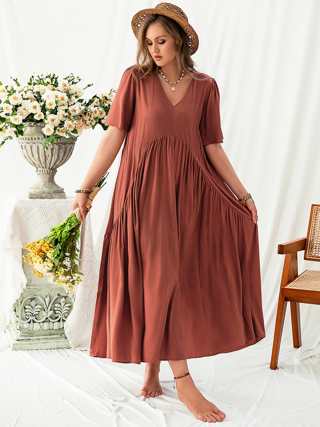 Trendsi plus size v neck midi dress in rust color with short sleeves and flowy skirt