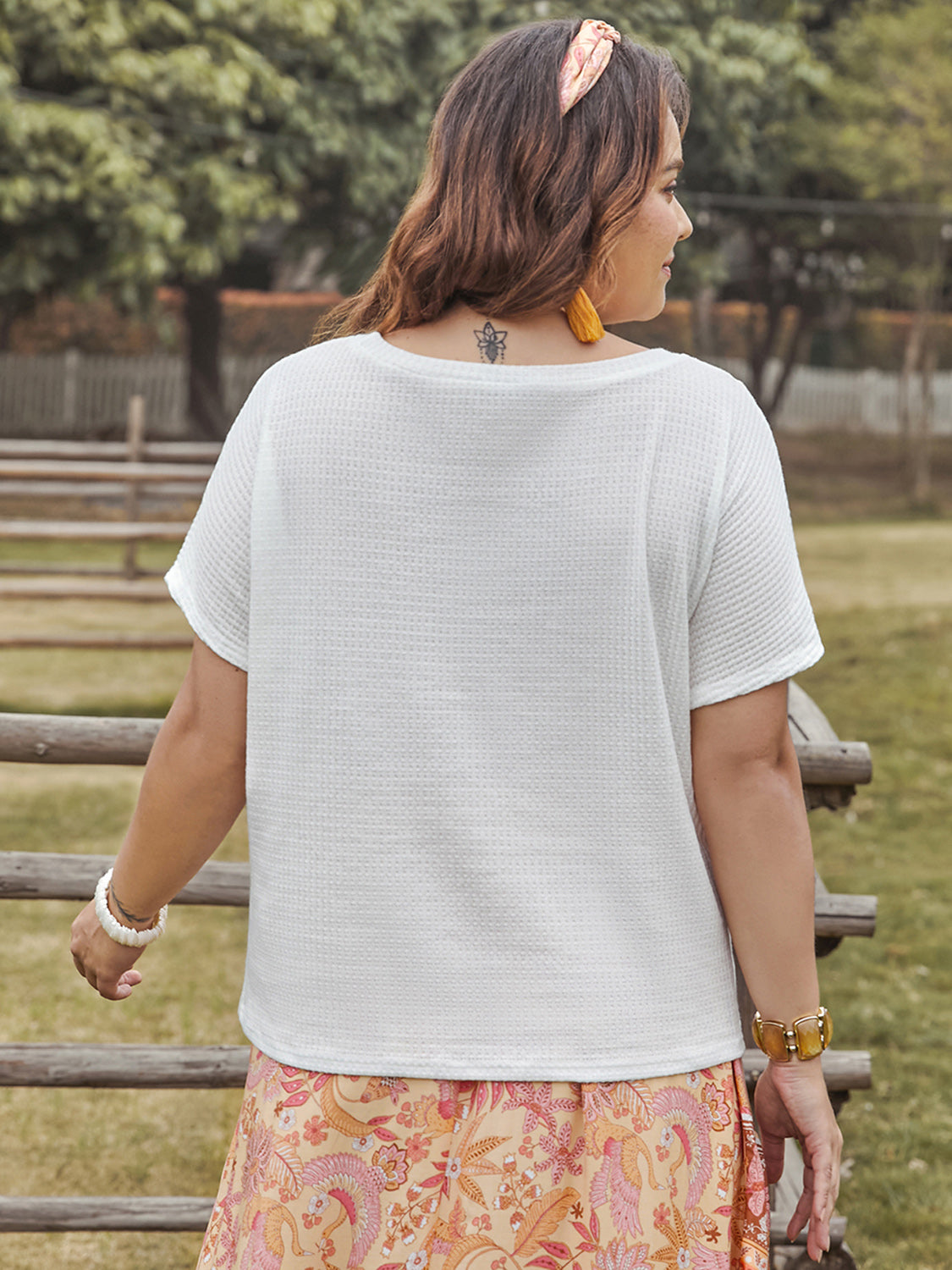 Trendsi round neck short sleeve plus size blouse in white waffle texture on woman outdoors
