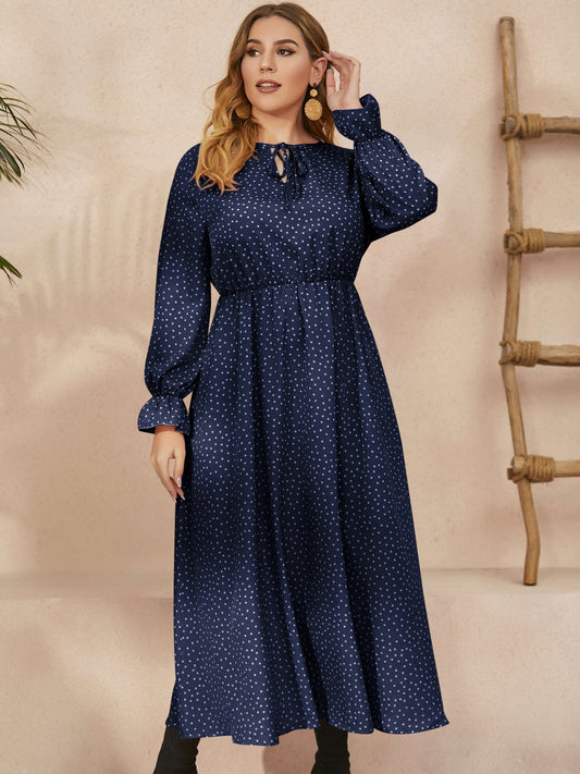 Plus size navy polka dot ruffled long sleeve dress with a defined waist by Honey Plus Size